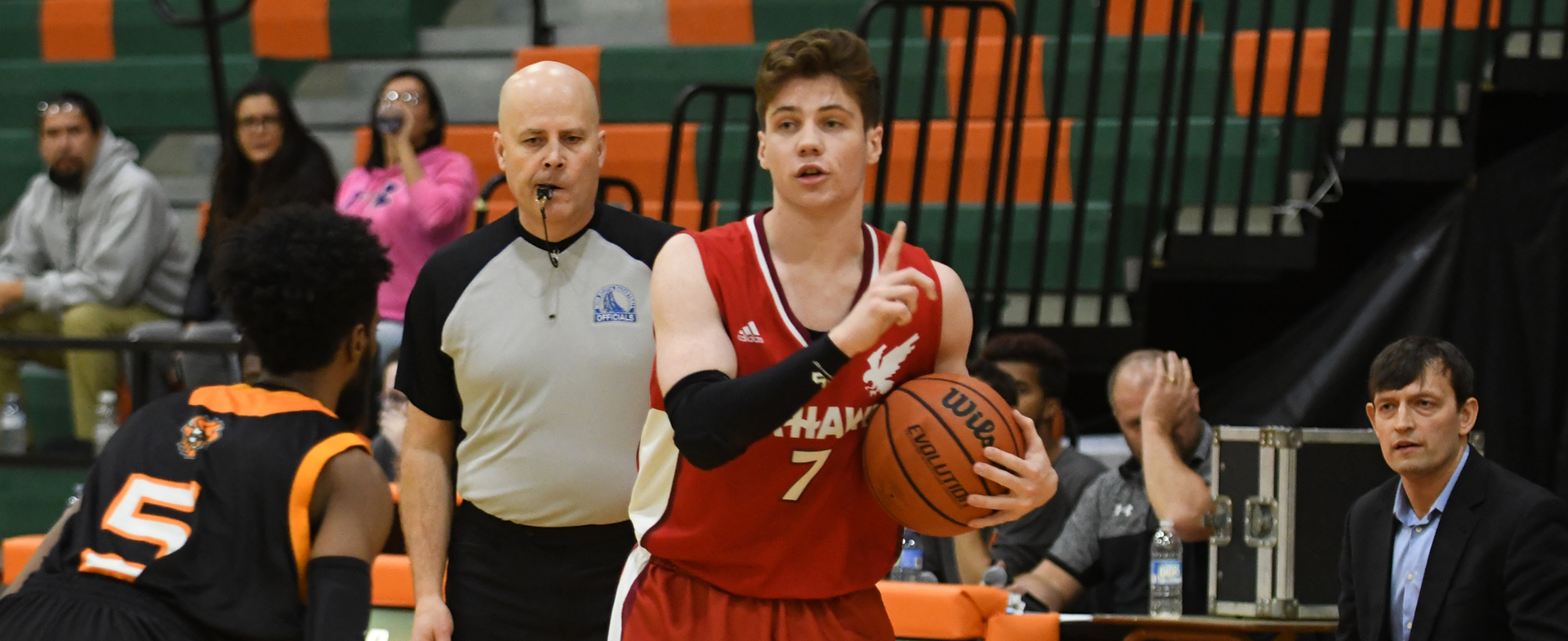 Capers Rally Late to Defeat Hawks